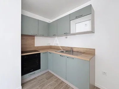Kitchen; kitchen appliances, tile floor, wood floor, renovated, natural light