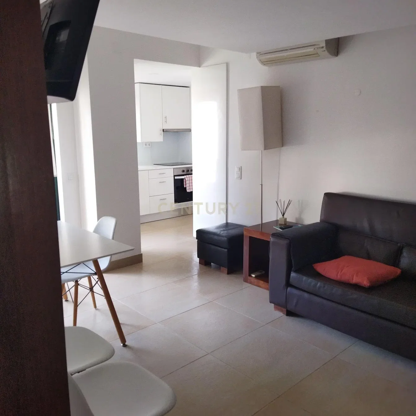 Living room; tile floor, natural light, kitchen appliances