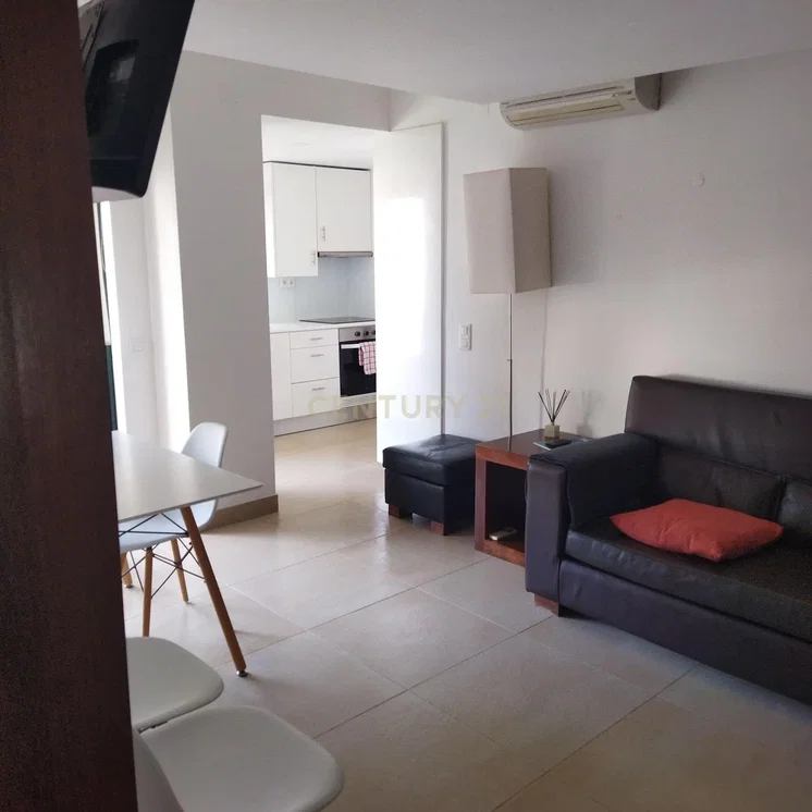 Living room; tile floor, natural light, kitchen appliances