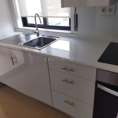Kitchen; kitchen appliances, tile floor, natural light