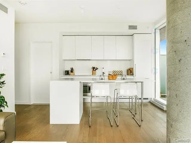 Kitchen; kitchen appliances, wood floor, natural light