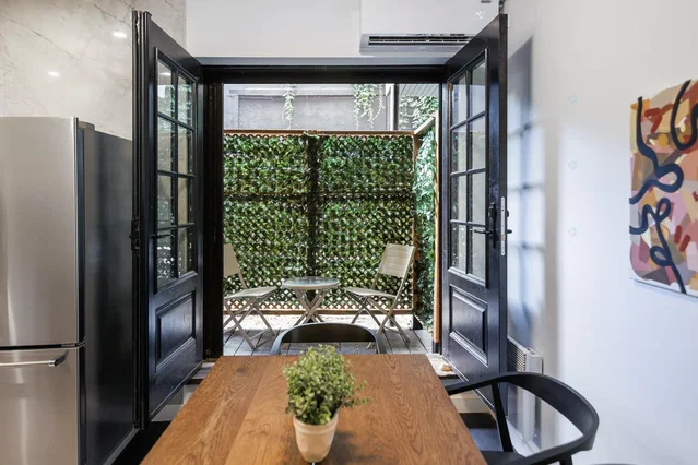 Kitchen; kitchen appliances, natural light, wood floor