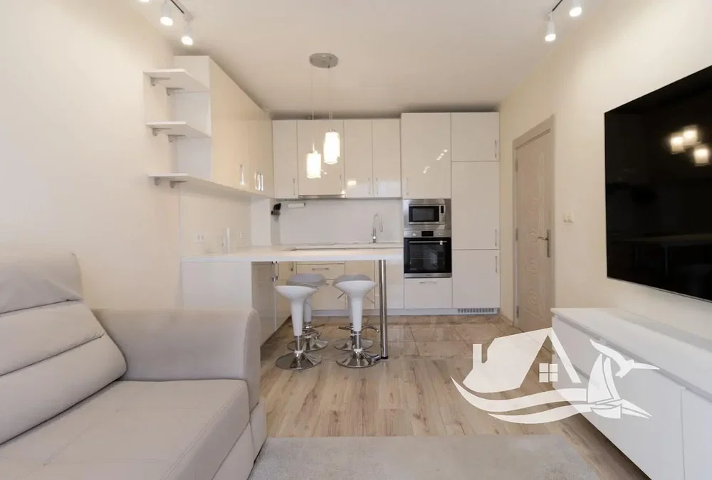 Living room; wood floor, natural light, modern style, kitchen appliances