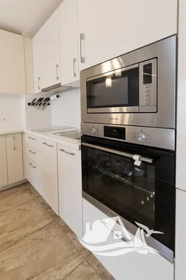 Kitchen; kitchen appliances, tile floor, renovated