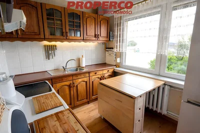 Kitchen; kitchen appliances, wood floor, natural light
