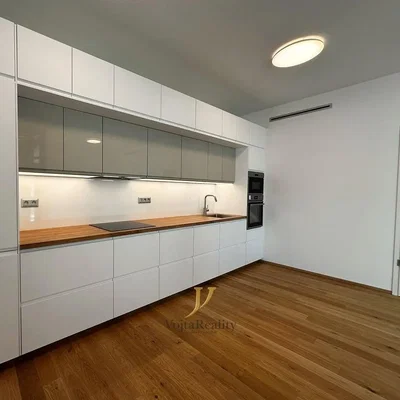 Kitchen; kitchen appliances, wood floor, natural light, renovated