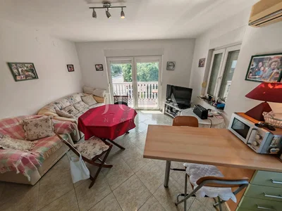 Living room; tile floor, natural light, rustic style