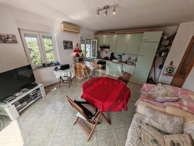 Living room; tile floor, natural light, modern style, kitchen appliances