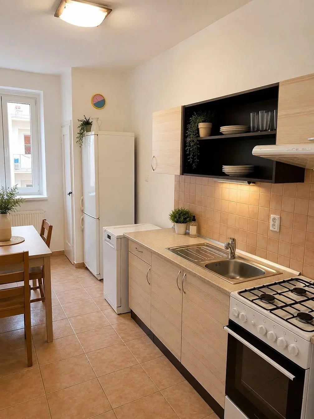 Kitchen; tile floor, kitchen appliances, natural light