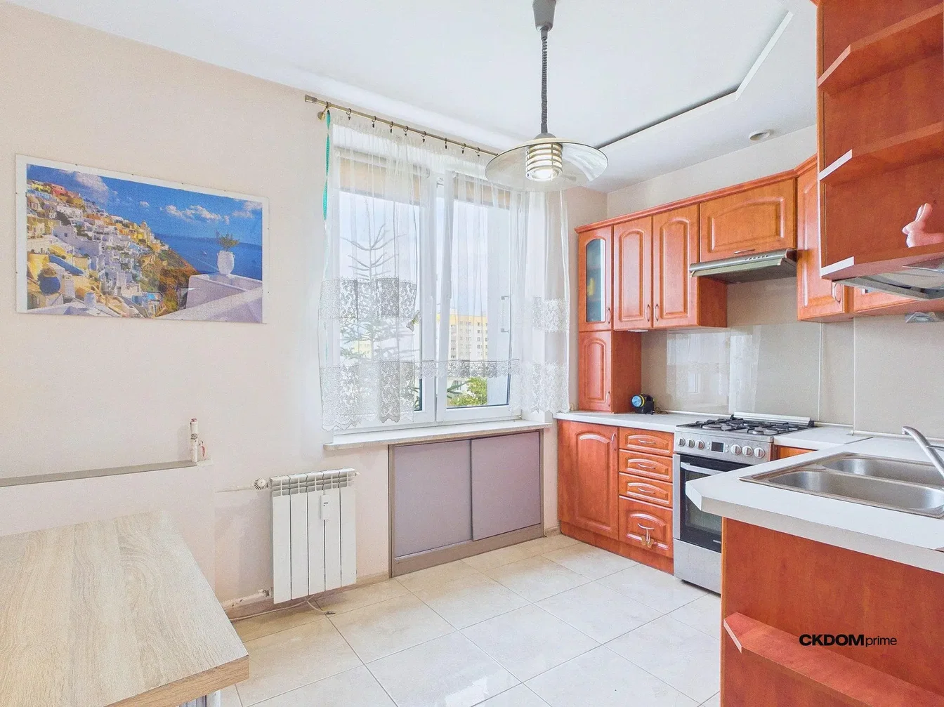 Kitchen; kitchen appliances, tile floor, natural light