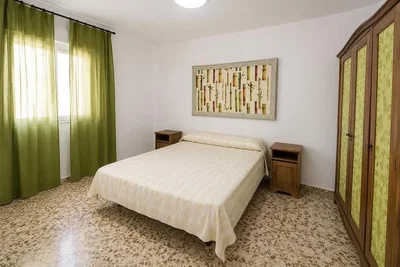 Bedroom; natural light, tile floor