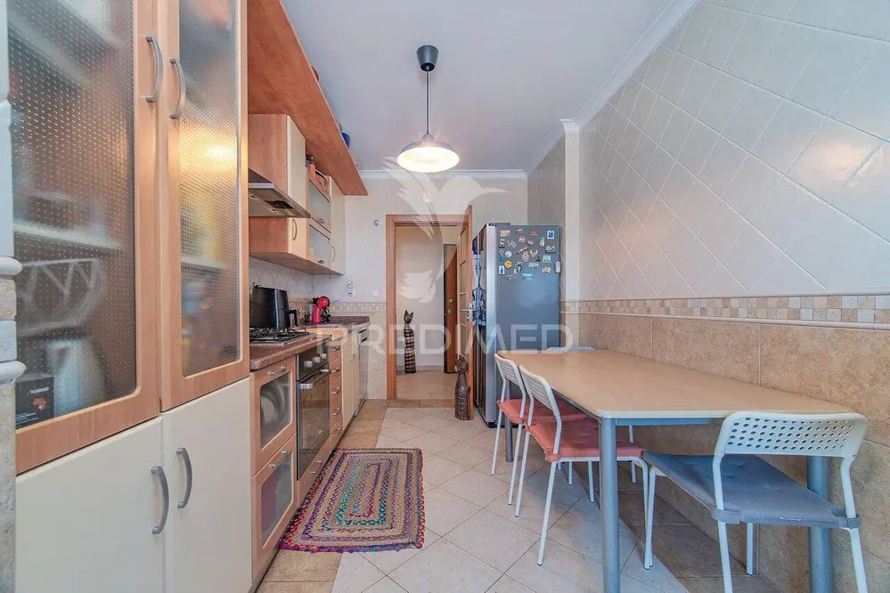 Kitchen; kitchen appliances, tile floor, natural light