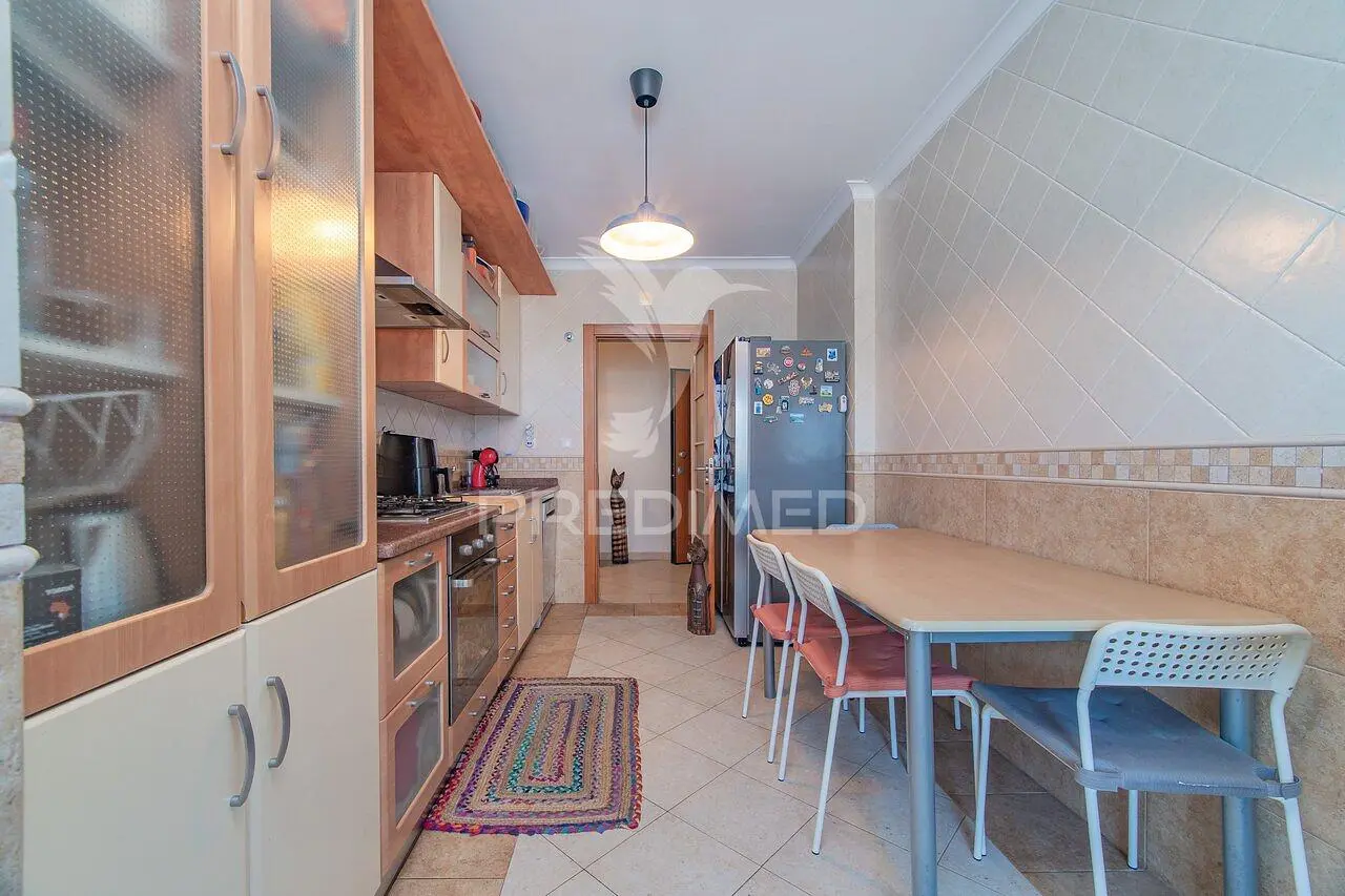 Kitchen; kitchen appliances, tile floor, natural light