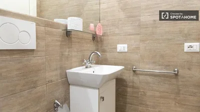 Toilet; tile floor, renovated, natural light