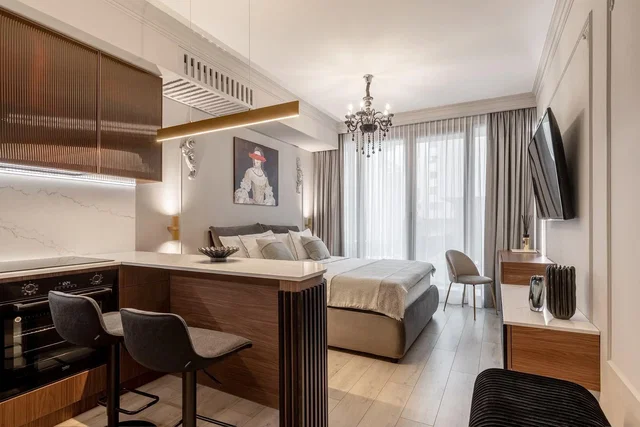 Bedroom; kitchen appliances, modern style, natural light, wood floor