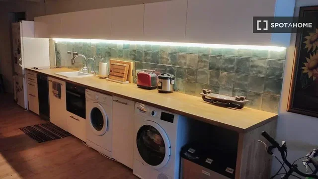 Kitchen; kitchen appliances, wood floor, natural light