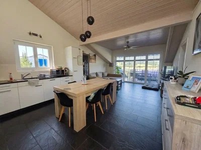 Kitchen; kitchen appliances, tile floor, natural light