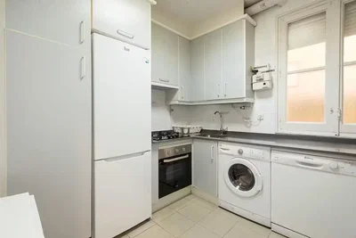 Kitchen; kitchen appliances, tile floor, natural light