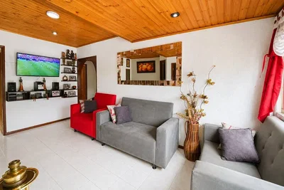 Living room; tile floor, wood beams, natural light