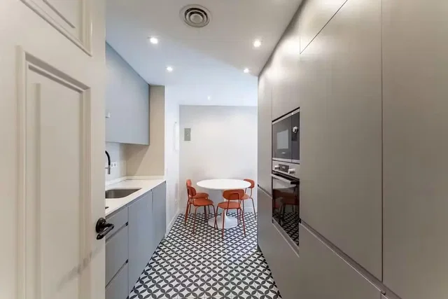 Kitchen; kitchen appliances, tile floor, renovated, natural light