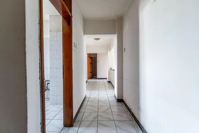Living room; tile floor, needs renovation, natural light