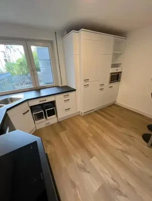 Kitchen; kitchen appliances, wood floor, natural light