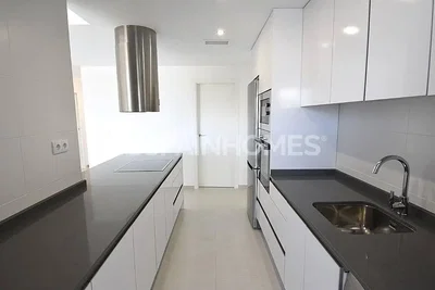 Kitchen; kitchen appliances, tile floor, natural light, renovated