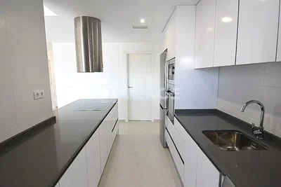 Kitchen; kitchen appliances, tile floor, natural light, modern style