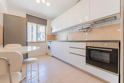 Kitchen; kitchen appliances, tile floor, natural light