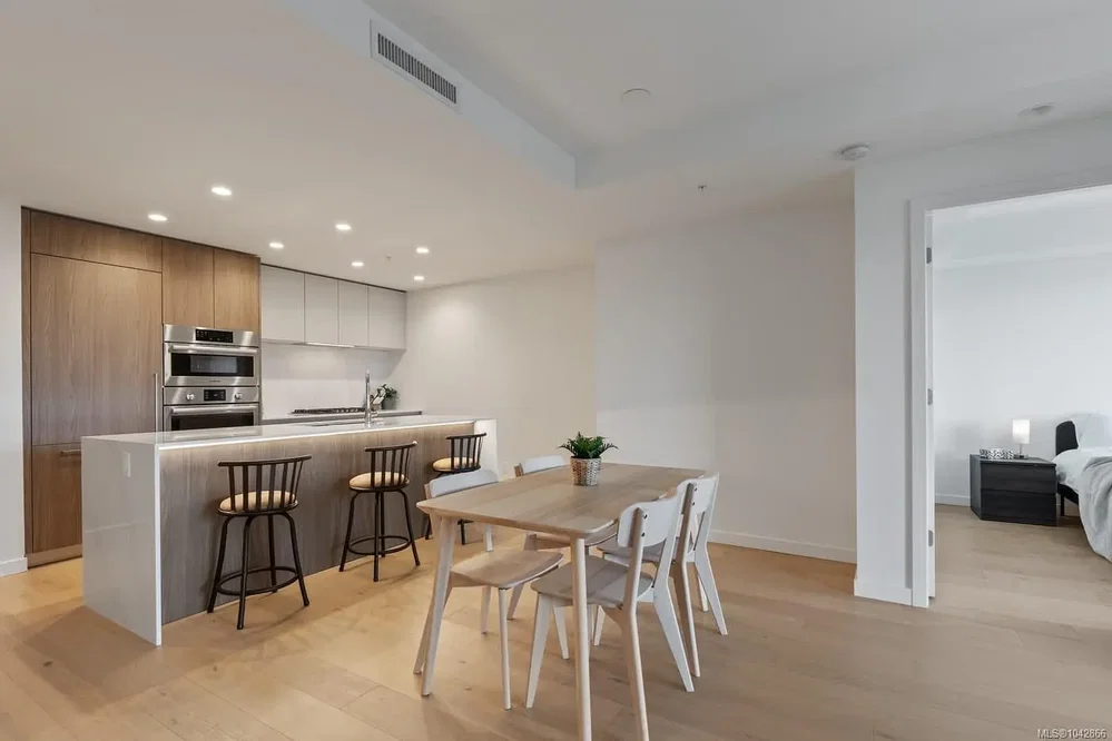 Kitchen; kitchen appliances, wood floor, natural light, renovated