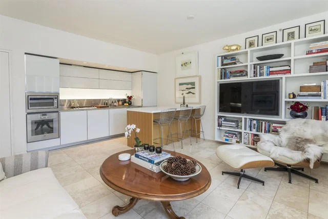 Living room; tile floor, kitchen appliances, natural light